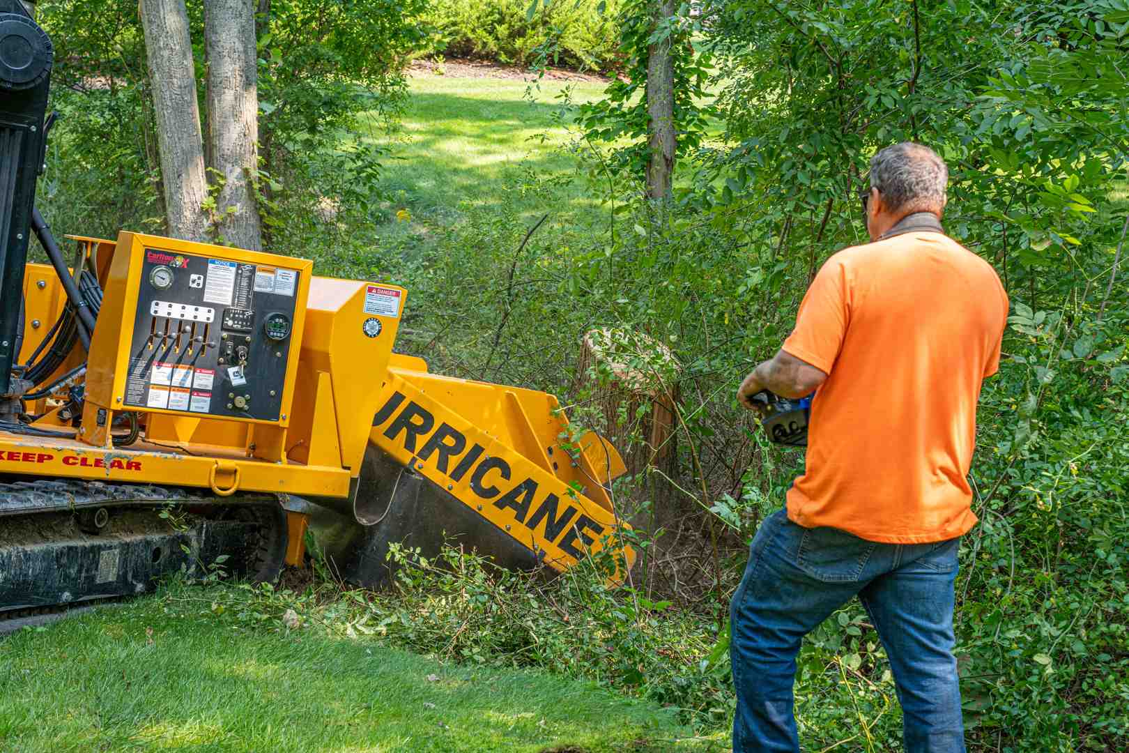 professional-grade stump grinder machine in action - stump grindering