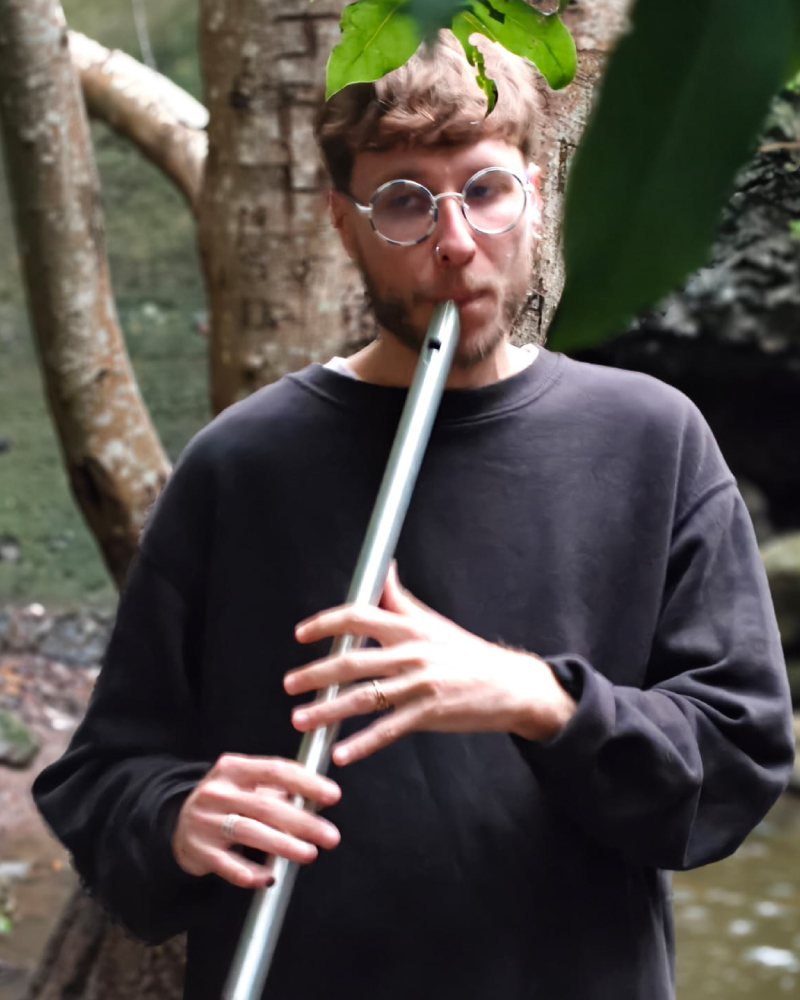 picture of me playing the flute in the woods