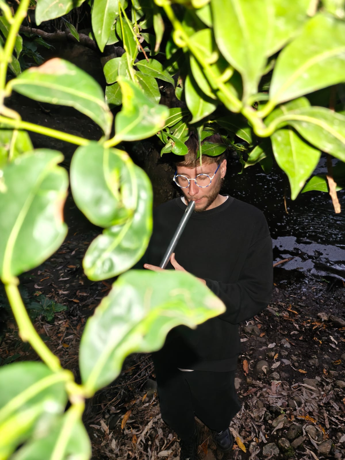 picture of me playing the flute in the woods