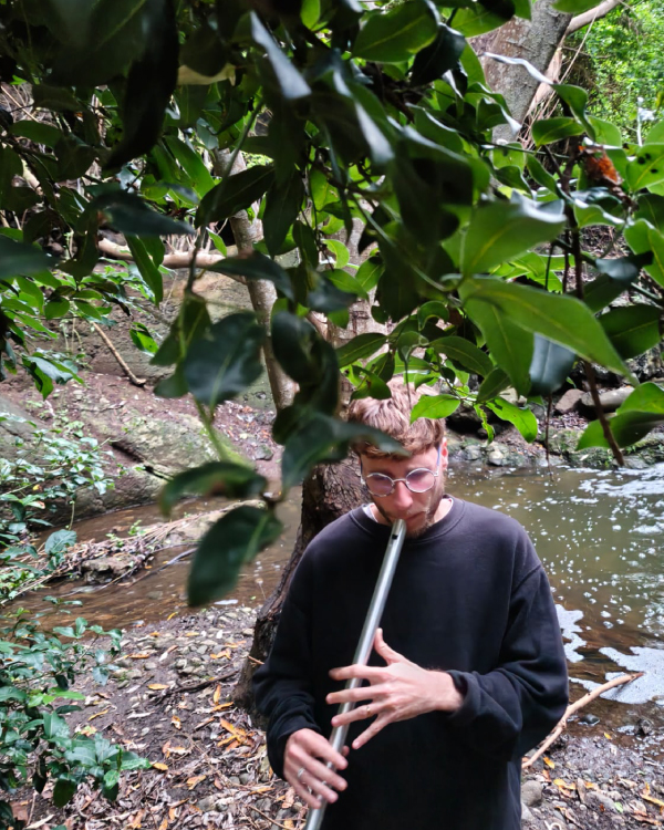 picture of me playing the flute in the woods