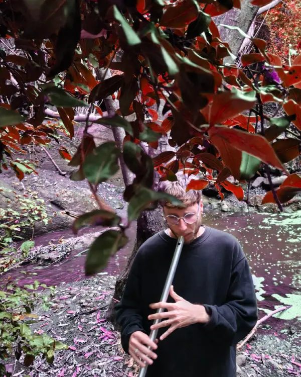 picture of me playing the flute in the woods