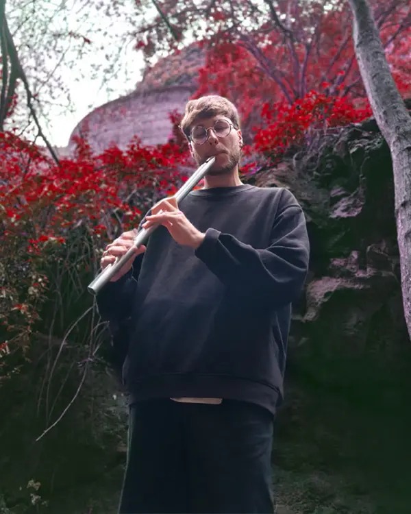 picture of me playing the flute in the woods