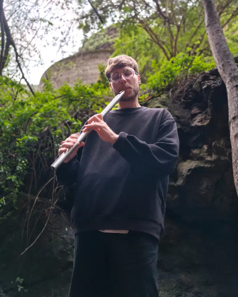 picture of me playing the flute in the woods
