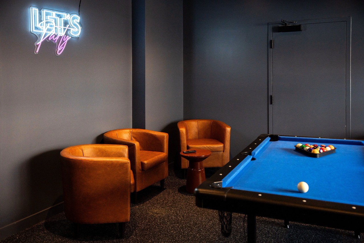 Modern game lounge at The Lafayette Stamford with seating and entertainment areas