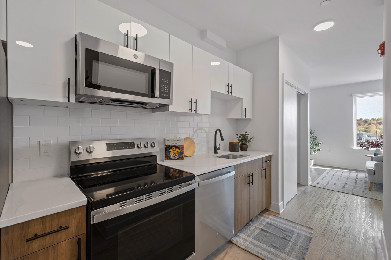 Studio apartment kitchen with stainless steel appliances at The Lafayette Stamford