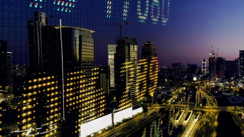 City skyline at dusk with high-rise buildings and roads reflecting digital stock market data.