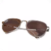 A pair of aviator-style sunglasses with brown tinted lenses and silver metal frames.