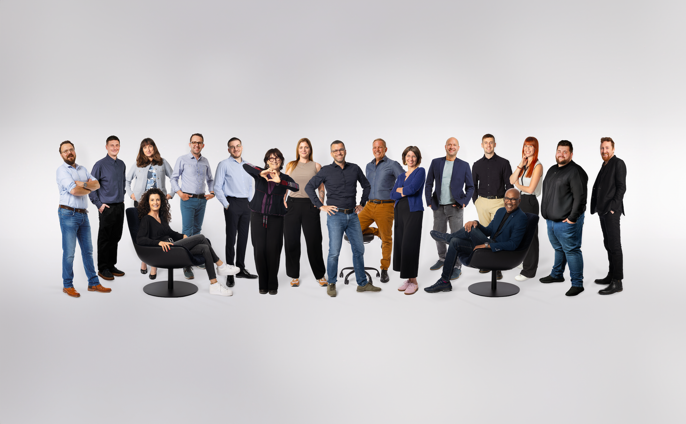 Formal shot of Vantage Core Team with Strategic Creative Director making heart gesture.