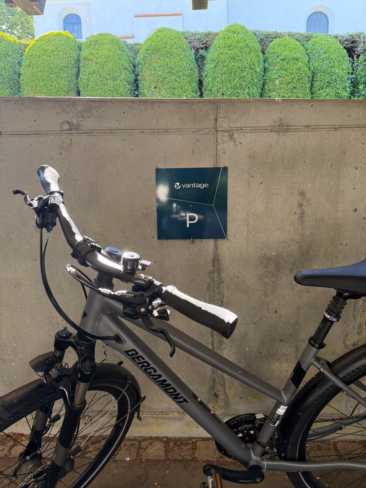 Bike parked infront of sign for Vantage car parking place.