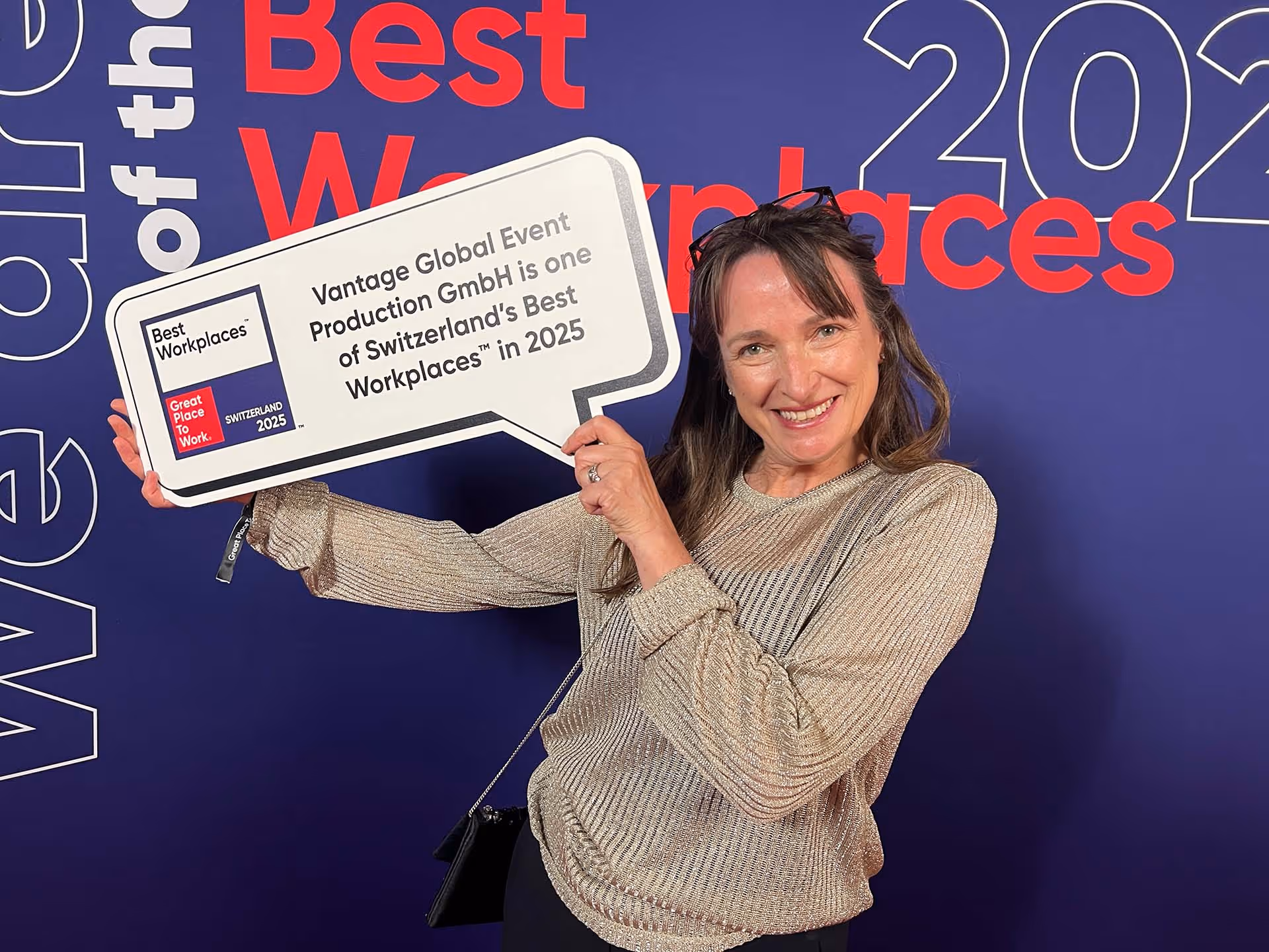 Client Services Director Lisa Ross-Magenty Blaettler with Great Place To Work award plaque.