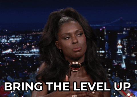 GIF of a woman on The Jimmy Fallen Show raising her hand up and the text saying "bring the level up"