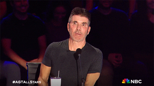 GIF of Simon Cowell looking confused 