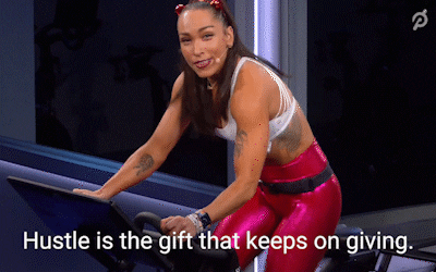 crazy workout woman running on a Peloton with the words "hustle is the gift that keeps on giving"