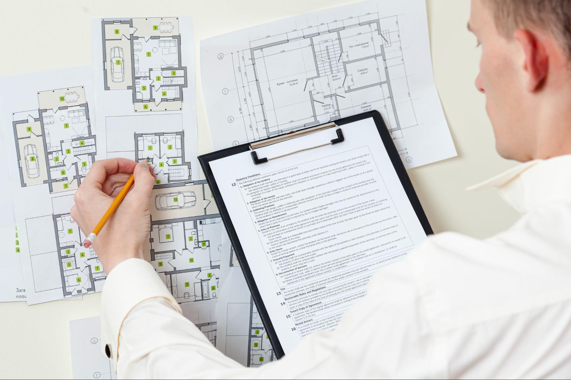 Close up of the paperwork and architectural drawings for the construction permit application.
