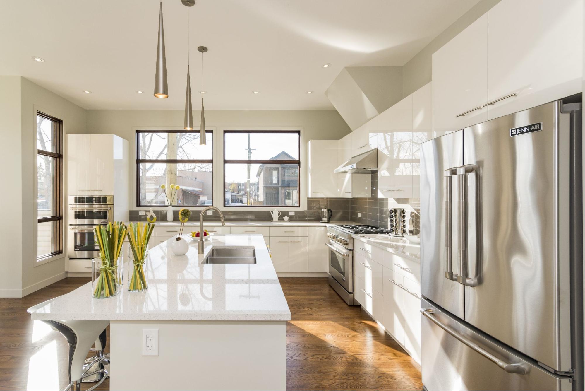 Newly renovated kitchen with windows, island, and an open-floor concept.