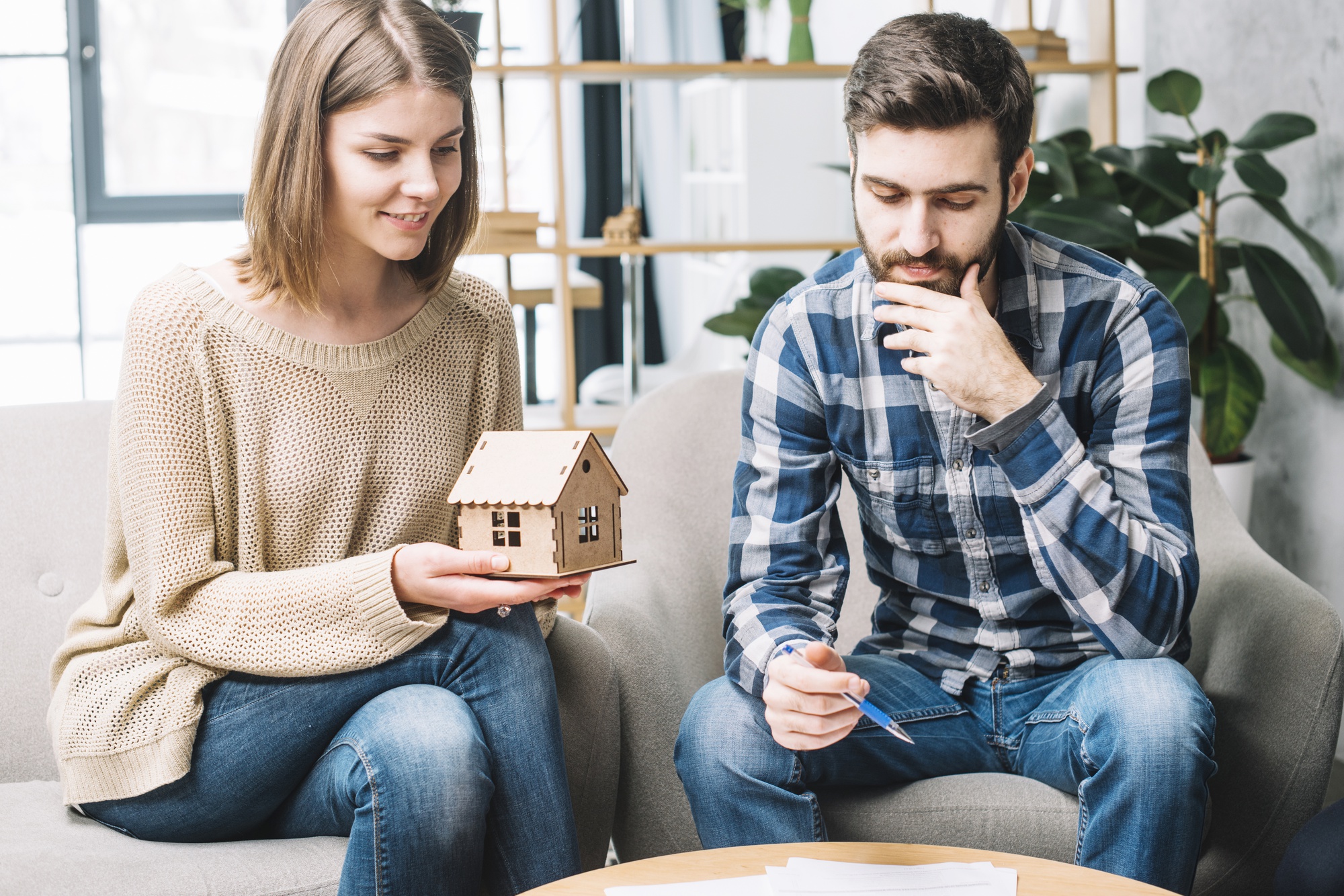 A young couple thinking about home improvement.