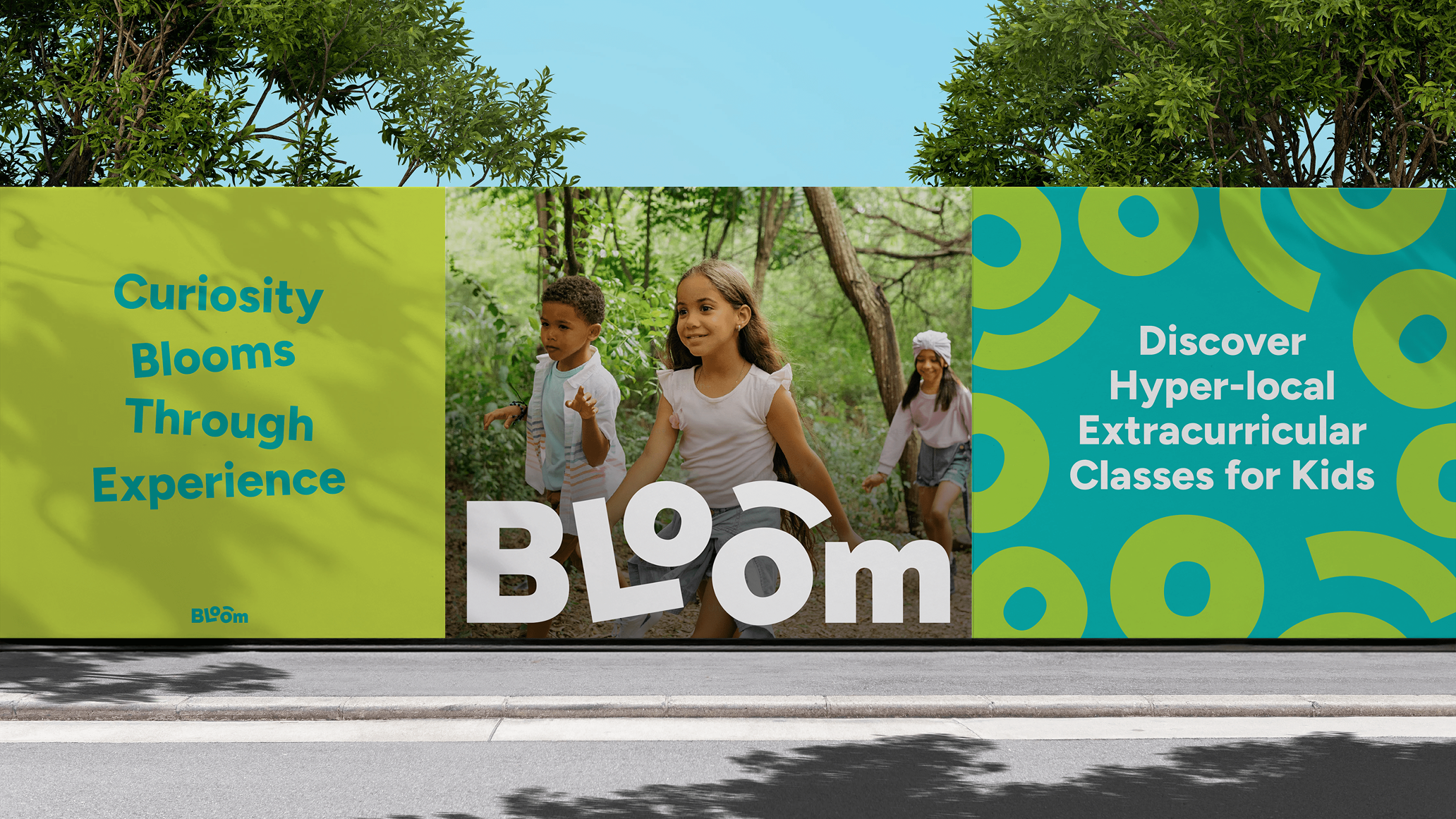 Outdoor billboard mockup featuring Bloom branding with children walking outdoors and the messages ‘Curiosity Blooms Through Experience’ and ‘Discover Hyper-local Extracurricular Classes for Kids.’