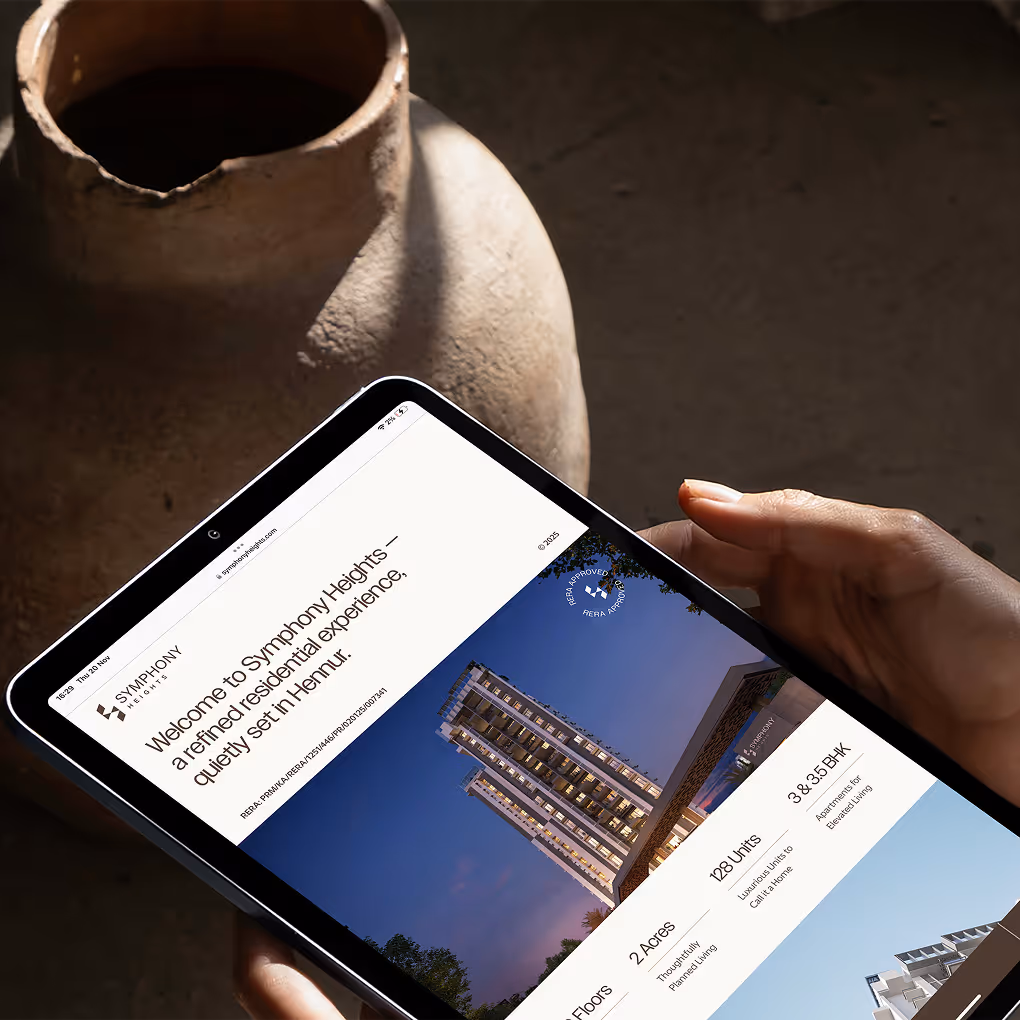 Tablet displaying Symphony Heights website homepage with tower visuals and project introduction.
