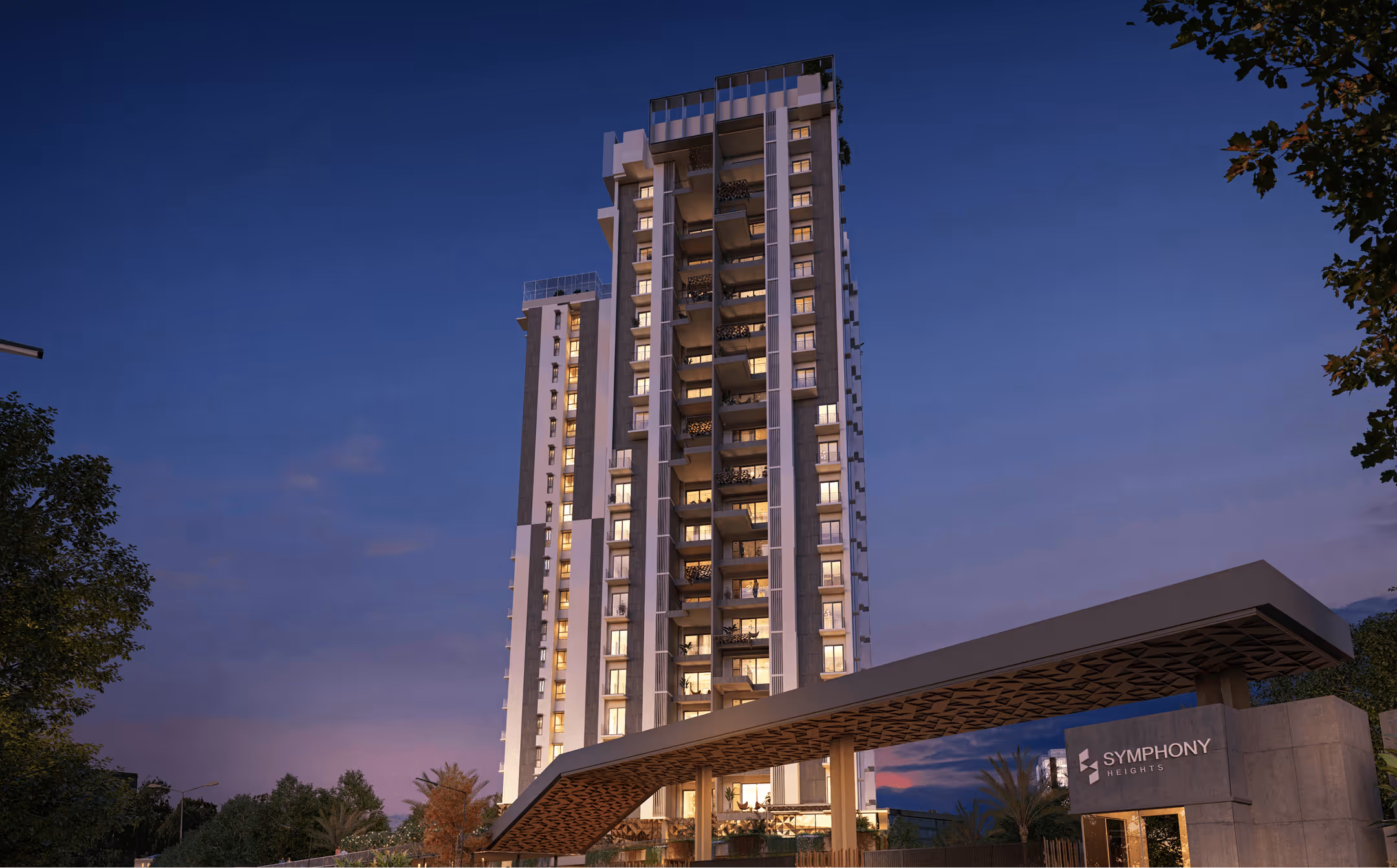 Night-time exterior view of Symphony Heights residential tower with illuminated balconies and entrance canopy, showcasing the project’s contemporary architecture.

