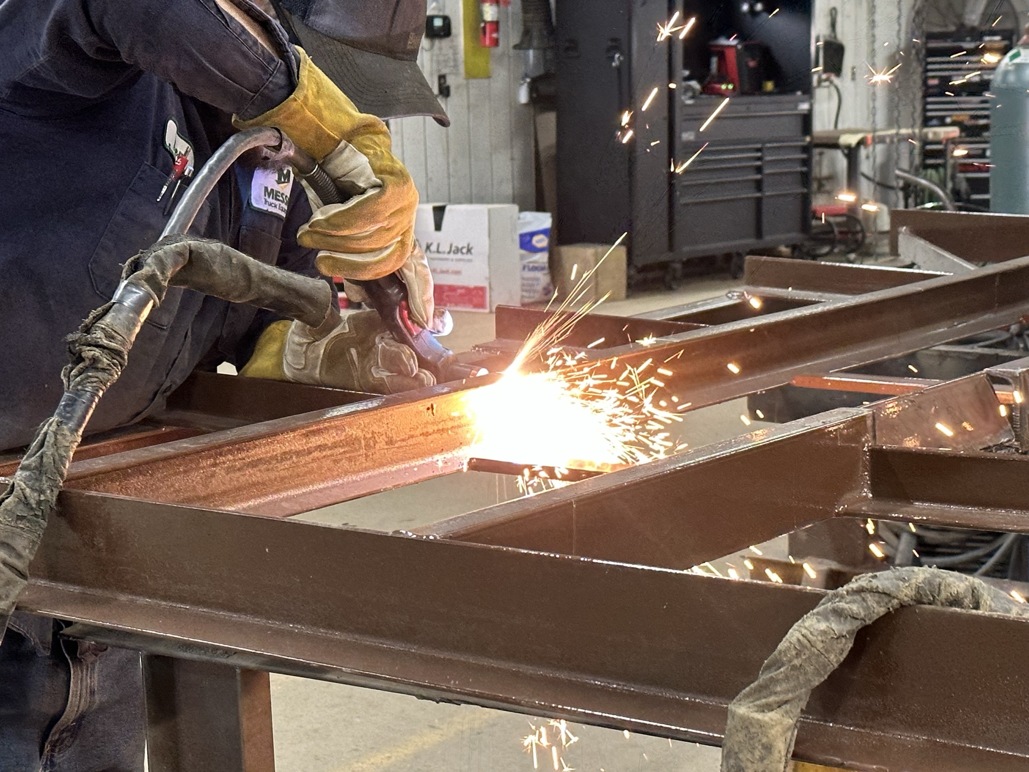 Ben welding a steel sander frame