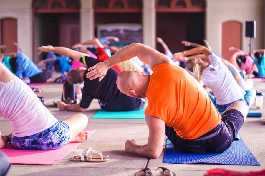 An image of people stretching as part of an exercise class