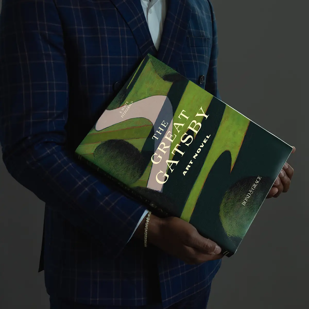 The Great Gatsby Art Novel being held by a man