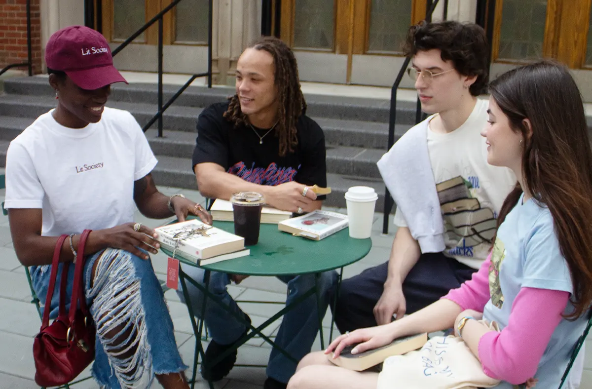 Various people wearing Lit Society Merch