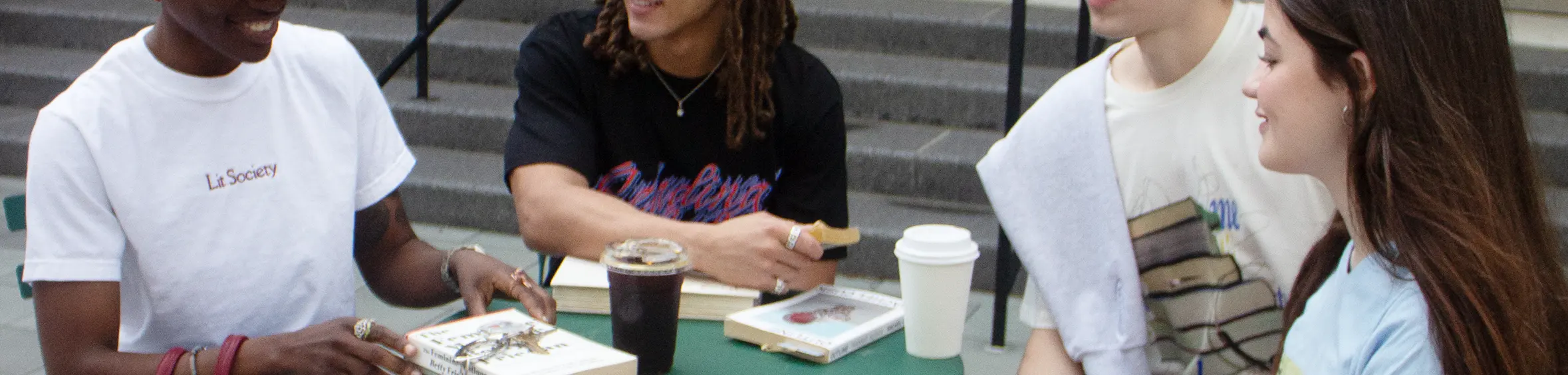 Various people wearing Lit Society Merch