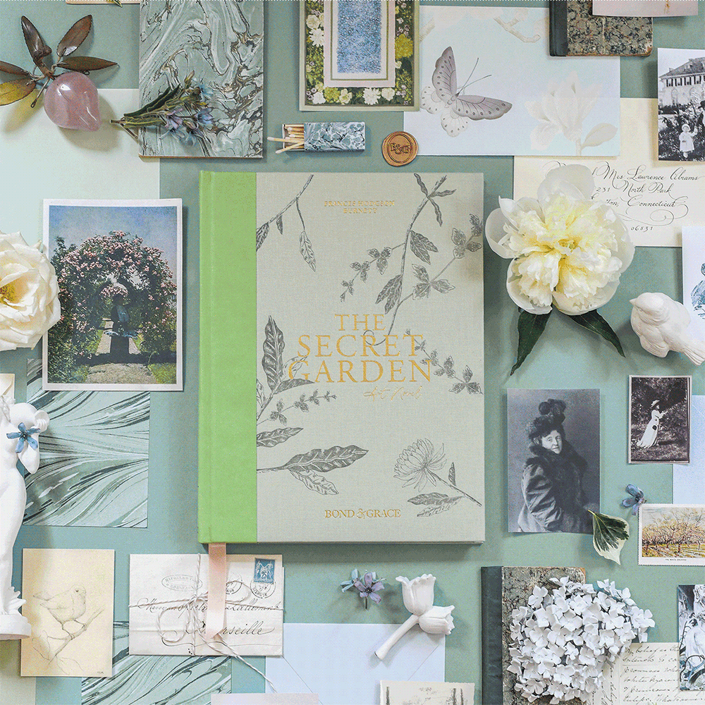The Secret Garden Art Novel next to flowers