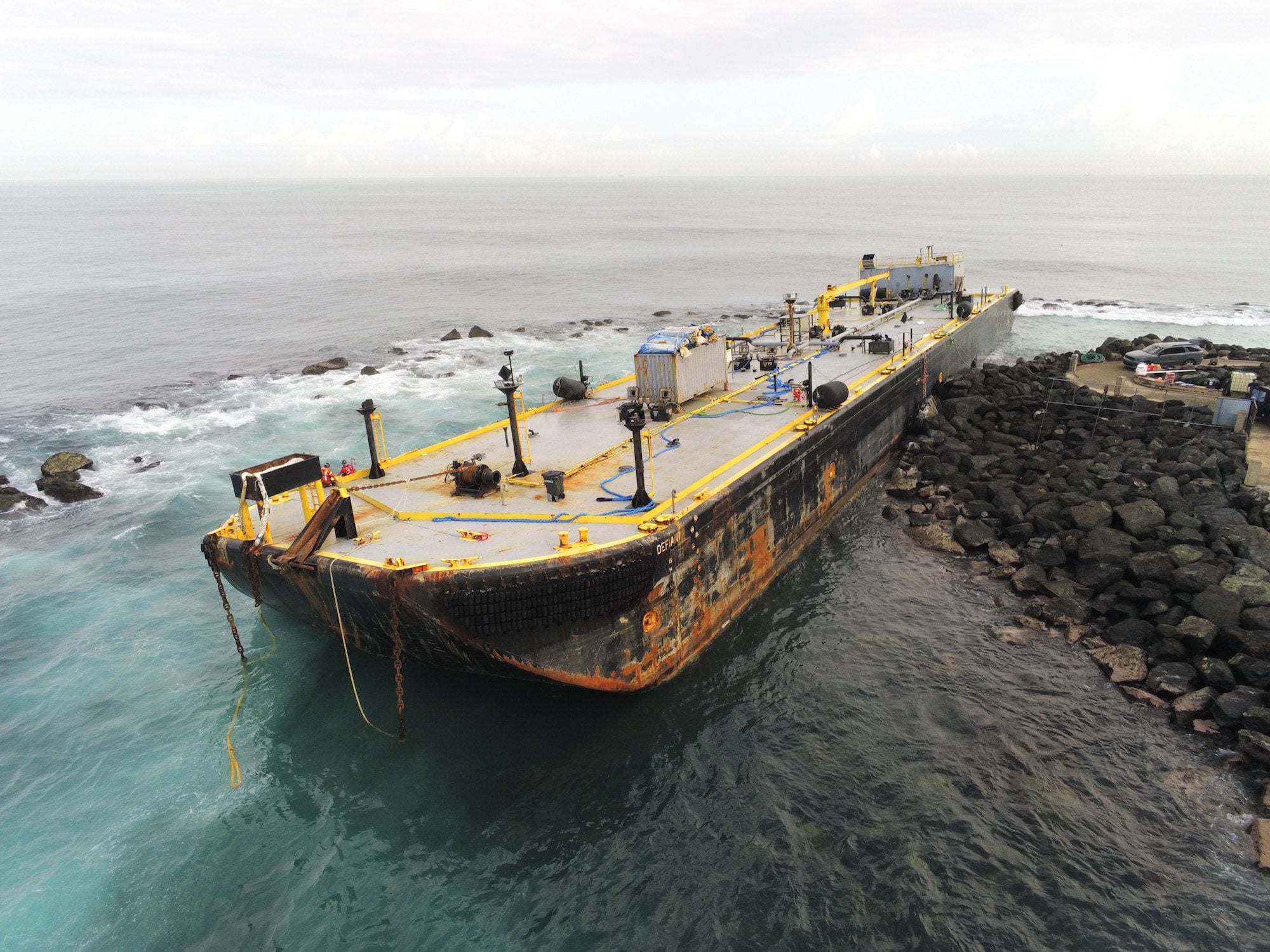 Salvage Crews Remove Fuel From Grounded Barge Near San Juan Harbor