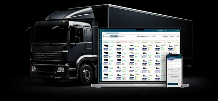 Caminhão ao fundo com um laptop e um celular na frente mostrando o software da Gestran