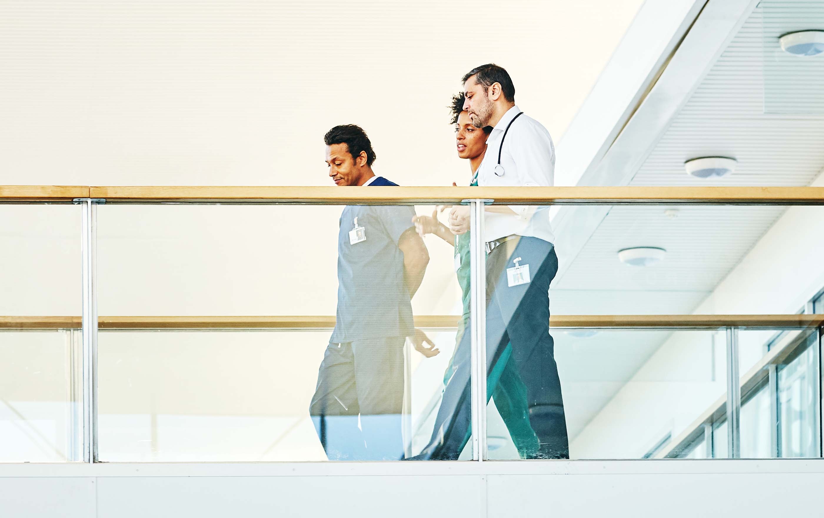 Employees having a discussion while walking