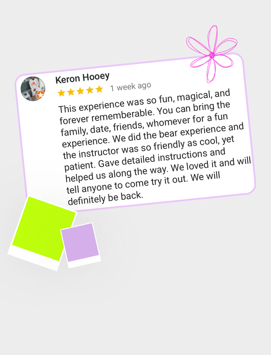 Smiling guest in a white coverall aiming the paint blaster cannon