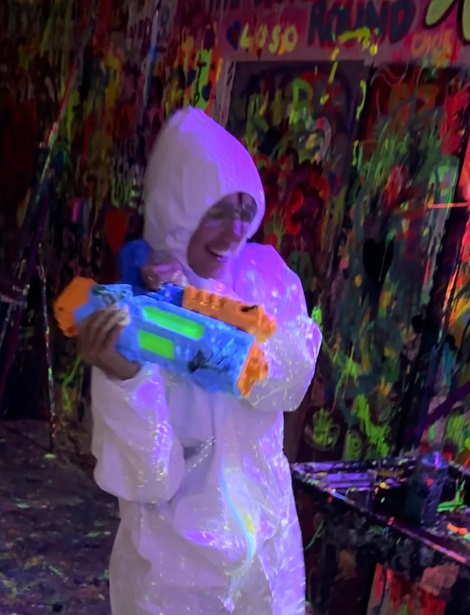 Another five-star review card praising the neon paint therapy