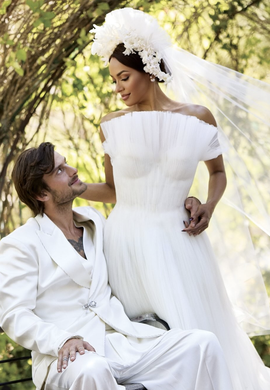 Kat and Bryant in wedding suit and gown