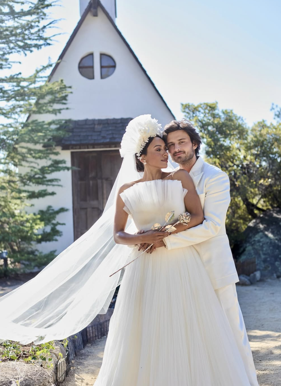 kat and bryant wedding photo in front of chapel