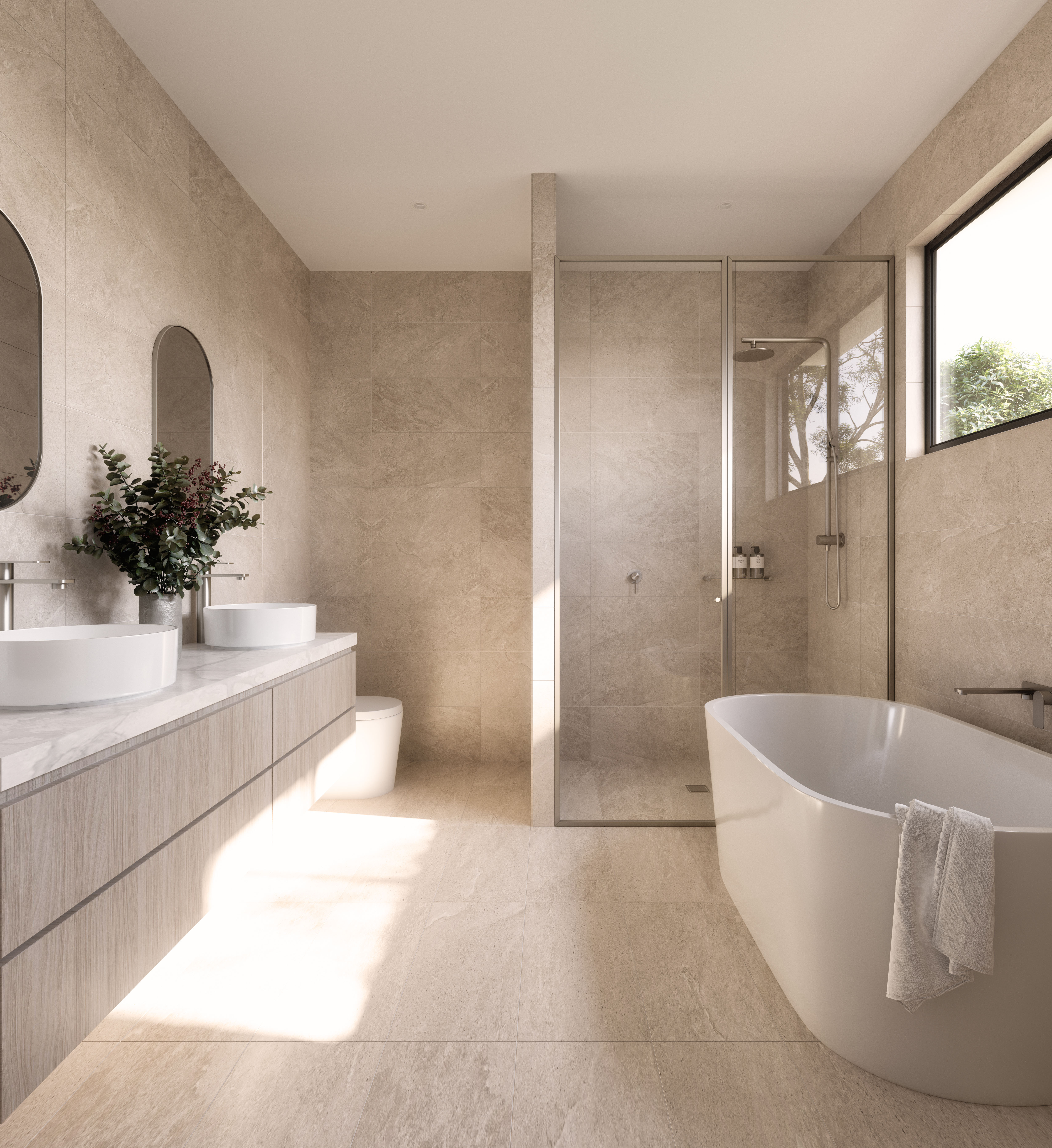 A bathroom with brushed nickel tapware, a bath, greige tiles and a floating double vanity