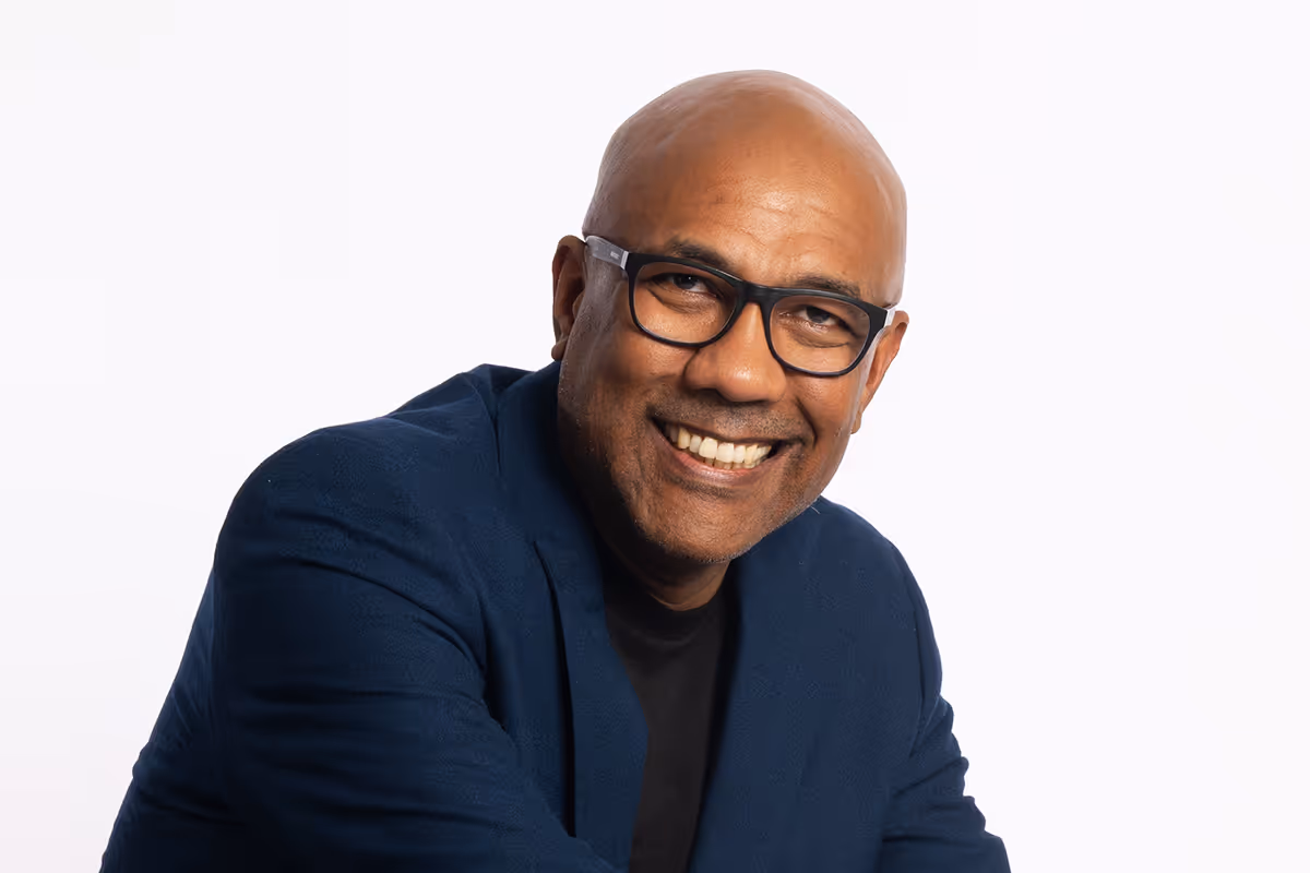 Sheldon Bovell, Event Producer, smiling portrait photograph.