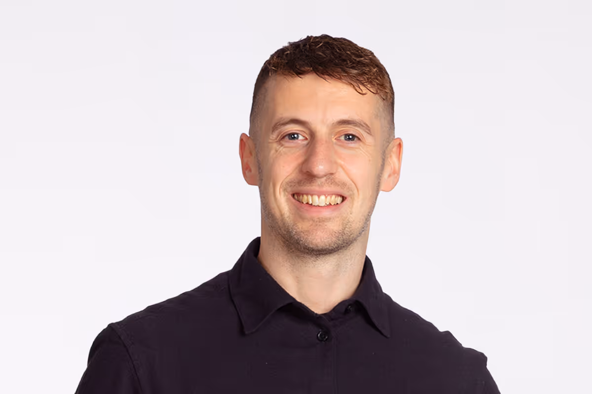 Jonathan Roberts, Event Producer, smiling portrait photograph.