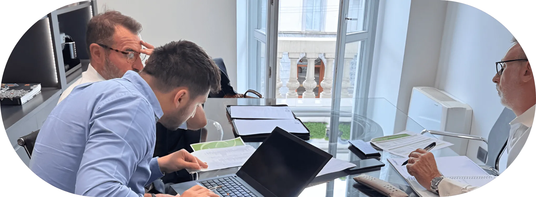 Three Perpethua executives in a group meeting