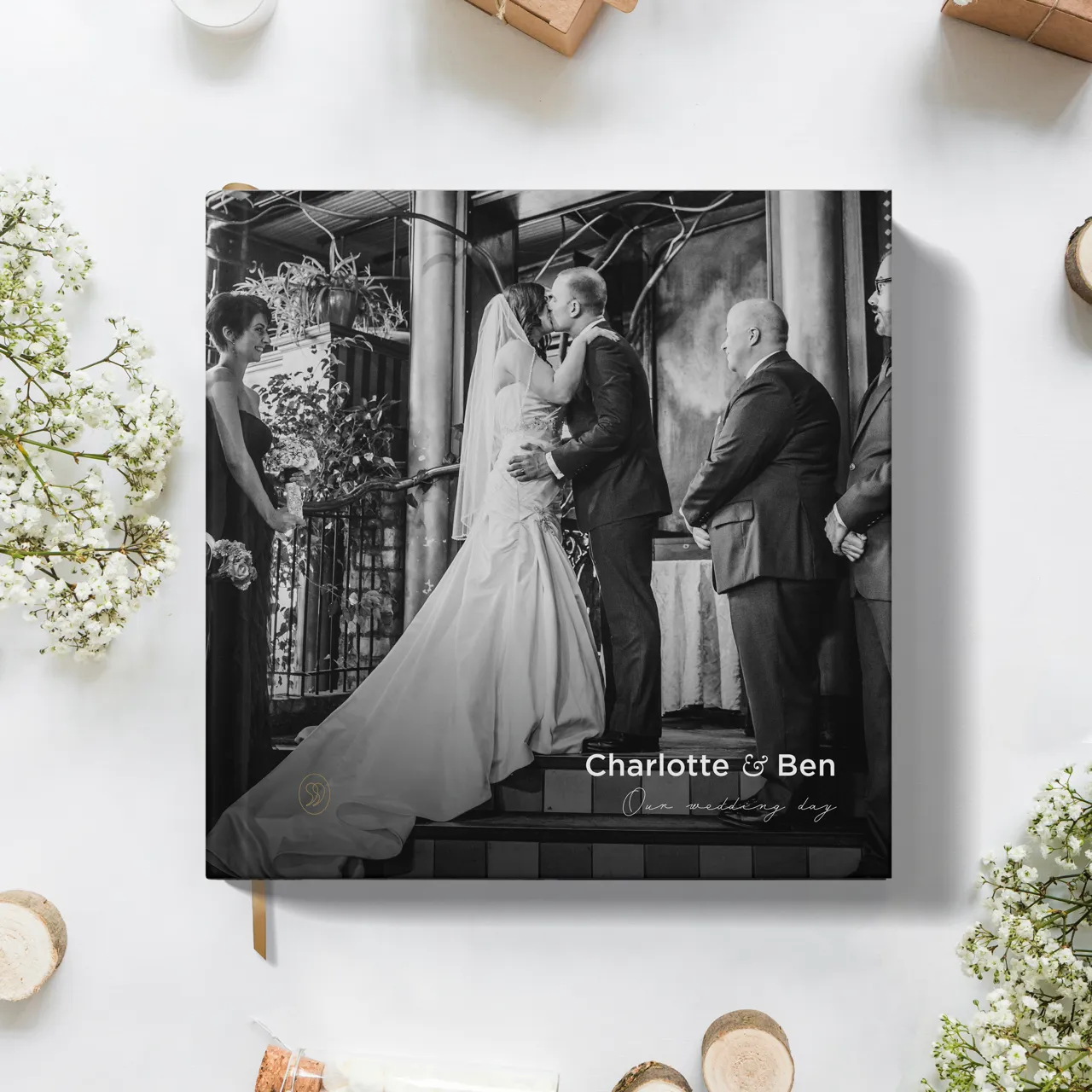 StoryTerrace - Books That Matter - Open book, "Charlotte and Ben's Story" with wedding photo.