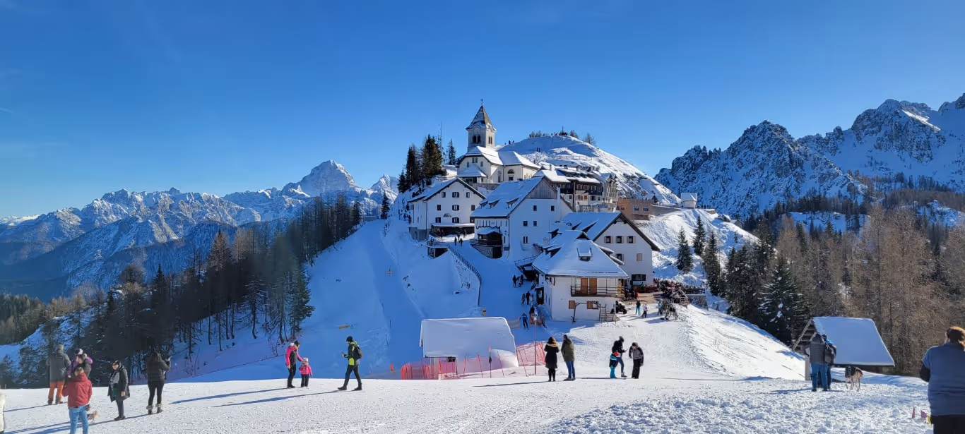 The picturesque mountain top village on Monte Lussari on a snowy day.