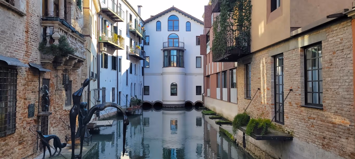 One of the canals in Treviso that ends in a beautiful white building. 