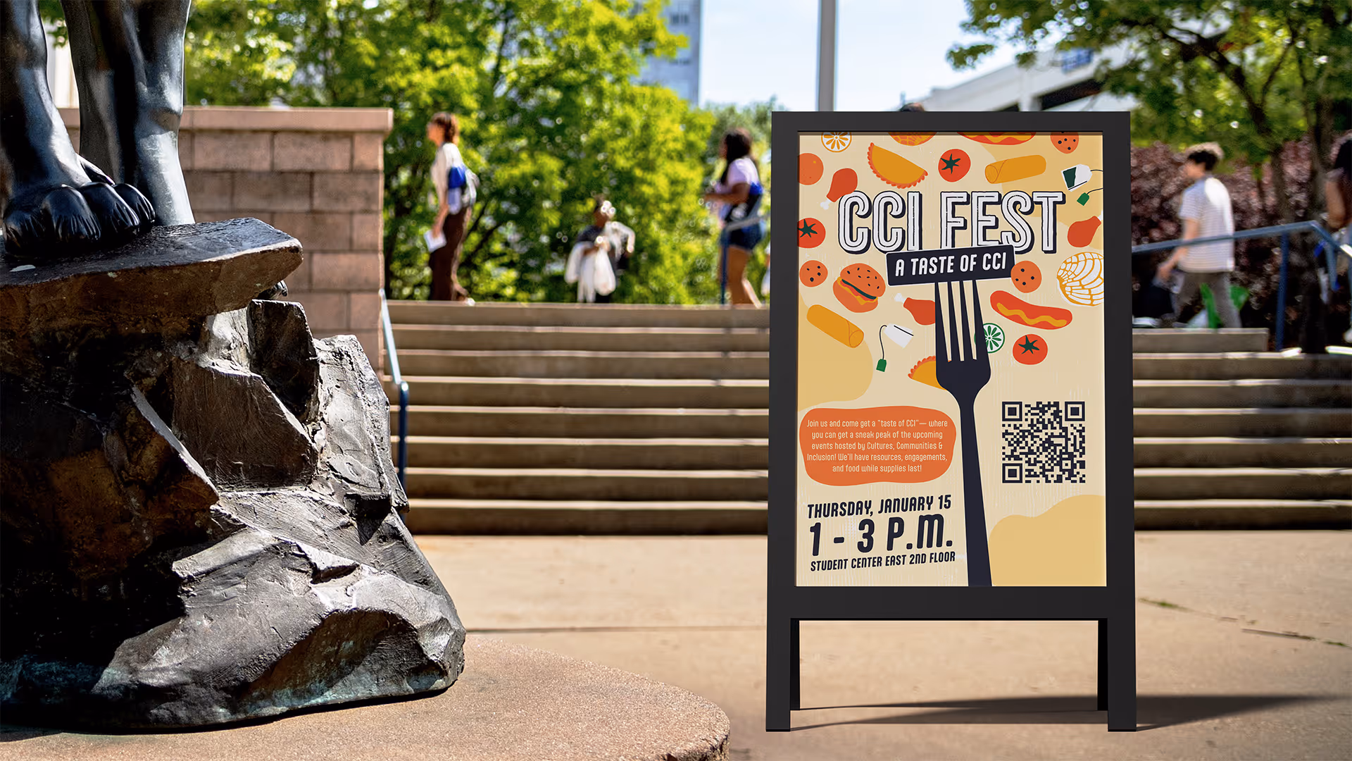 Signboard for CCI Fest event with food illustrations, date, time, and QR code near outdoor steps.