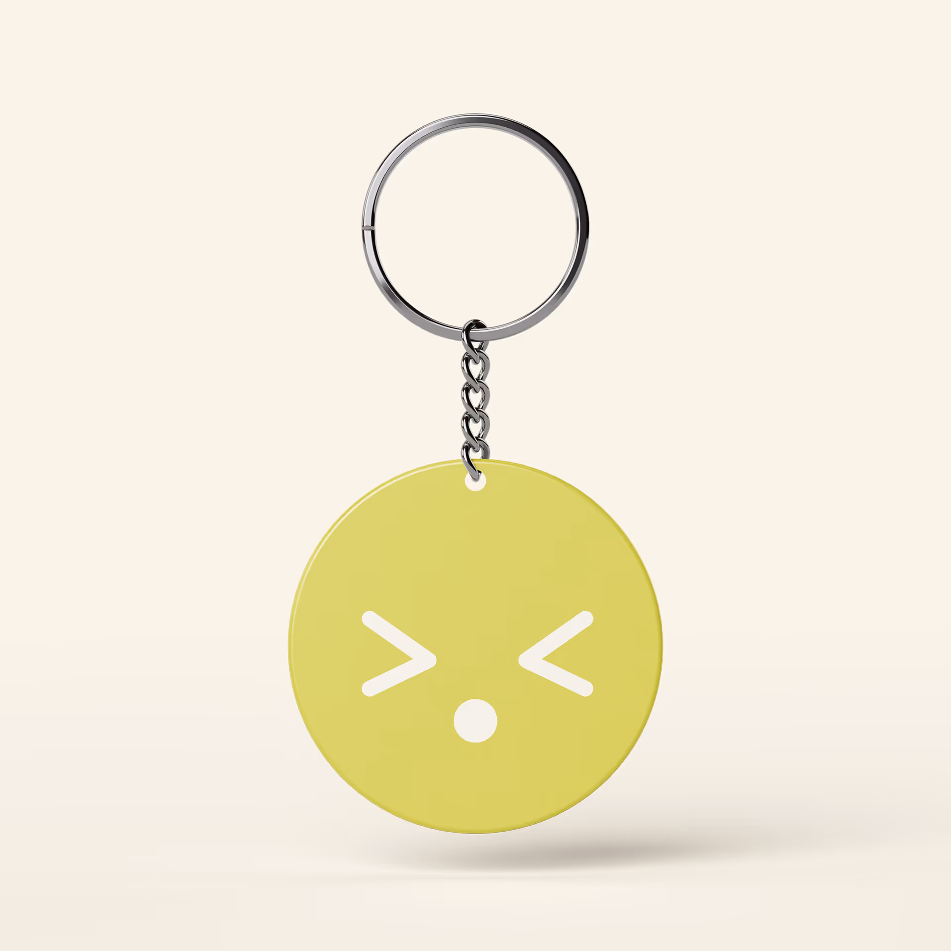 Green round keychain with a squinting face emoji and open mouth hanging from a silver ring.