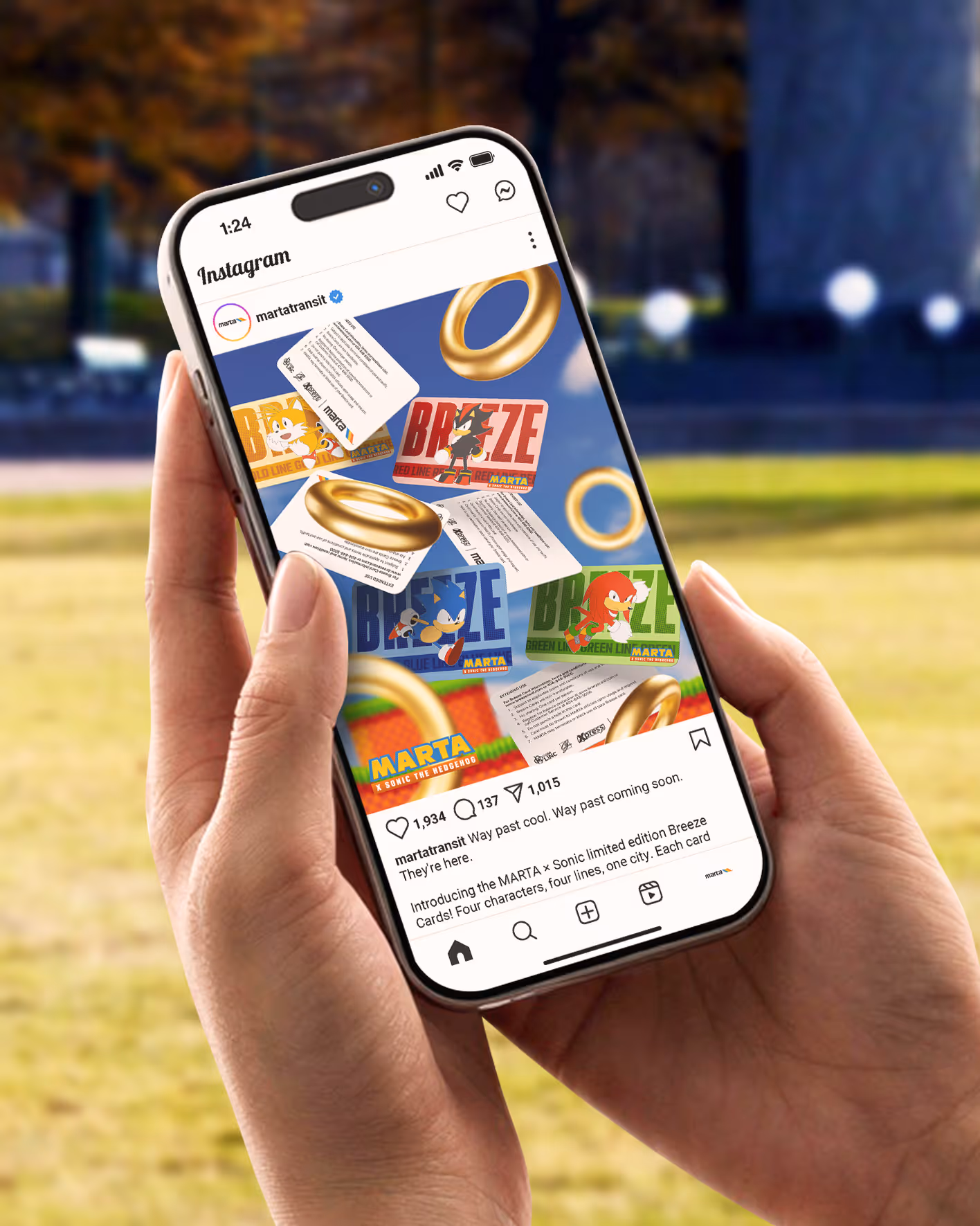 Person holding iPhone showing Instagram post of MARTA x Sonic limited edition Breeze transit cards.