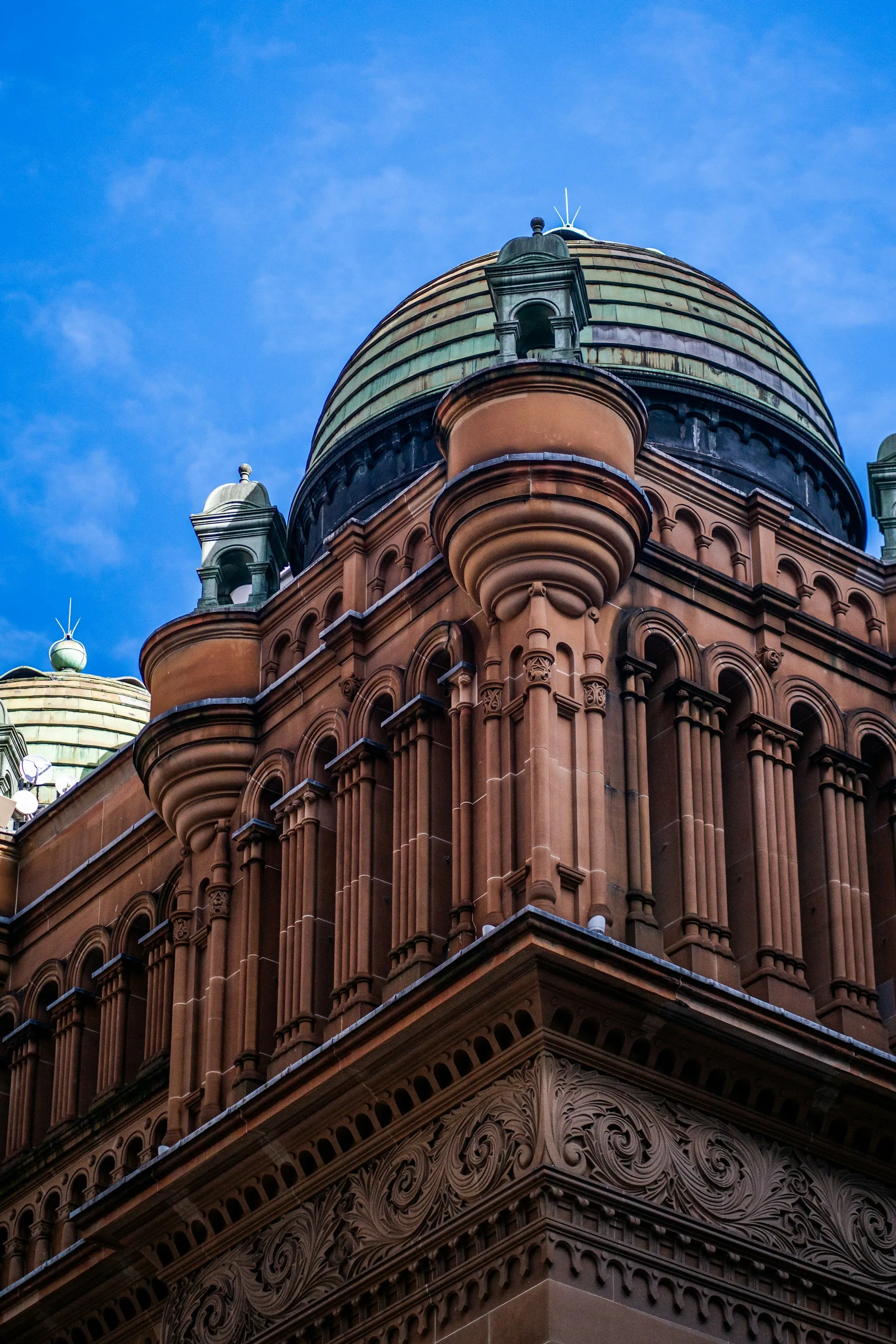 Close-up of the Queen Victoria Building in Sydney, showcasing its ornate sandstone architecture.