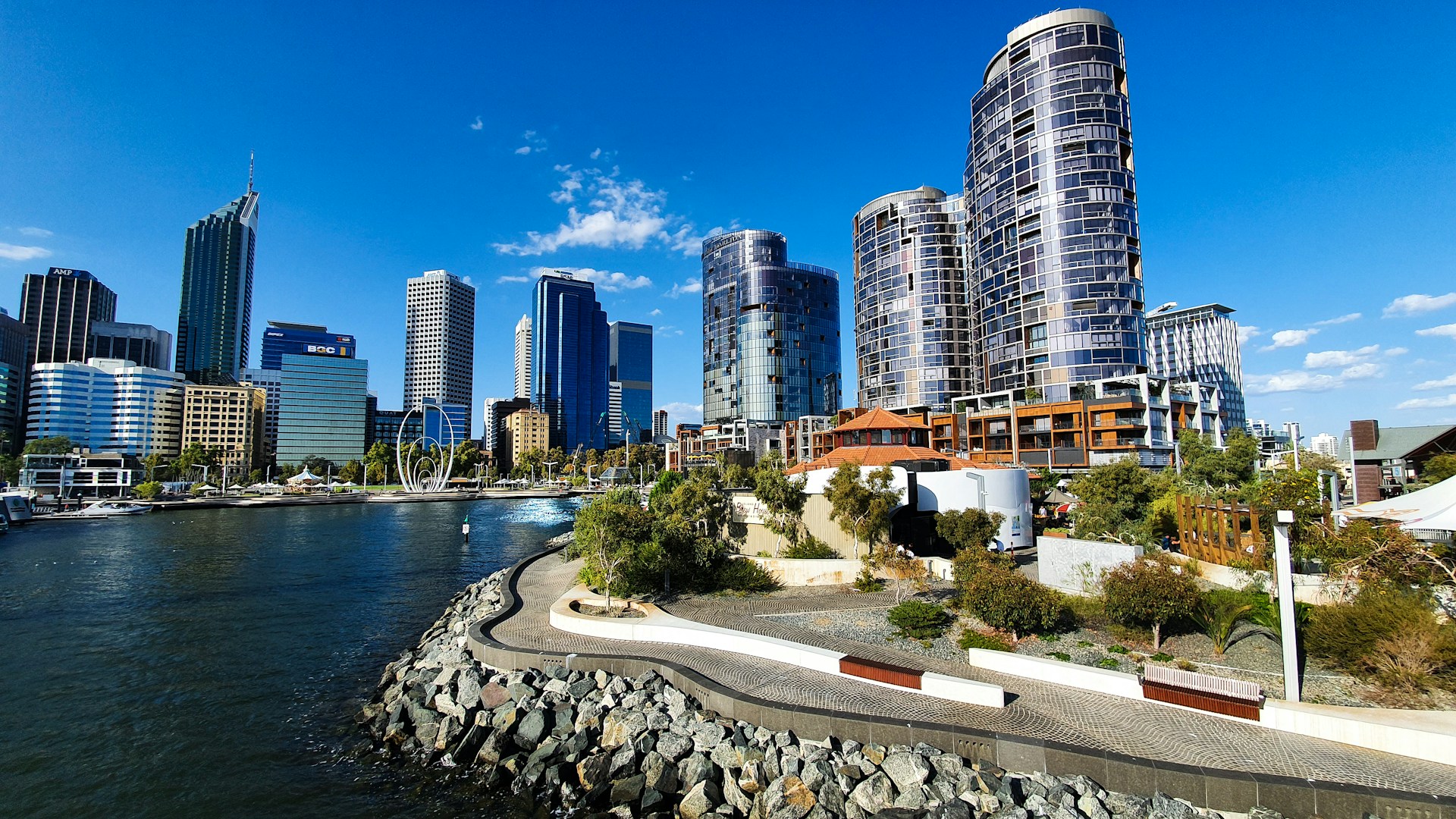 Perth city skyline with modern high-rise buildings along the Swan River.