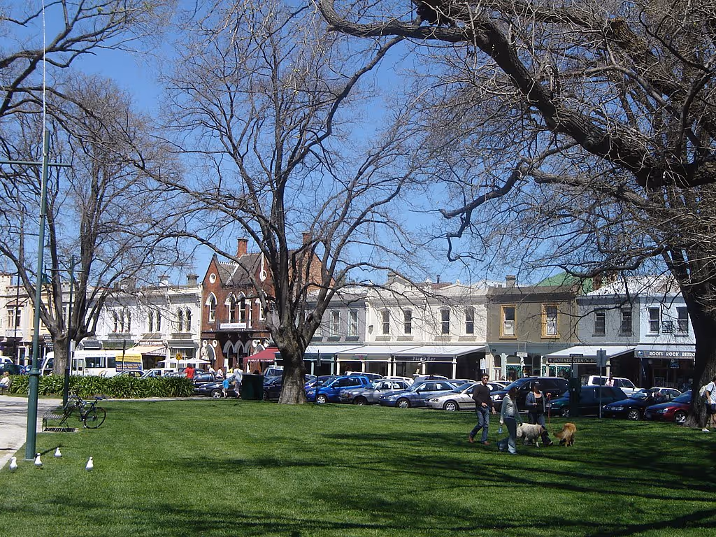 People walking dogs and relaxing on the grass with heritage buildings and shops along Nelson Place in Williamstown, Melbourne, Victoria.
Credit: en:User:Frances76, Wikimedia Commons: https://commons.wikimedia.org/wiki/File:Williamstown_Melbourne.JPG