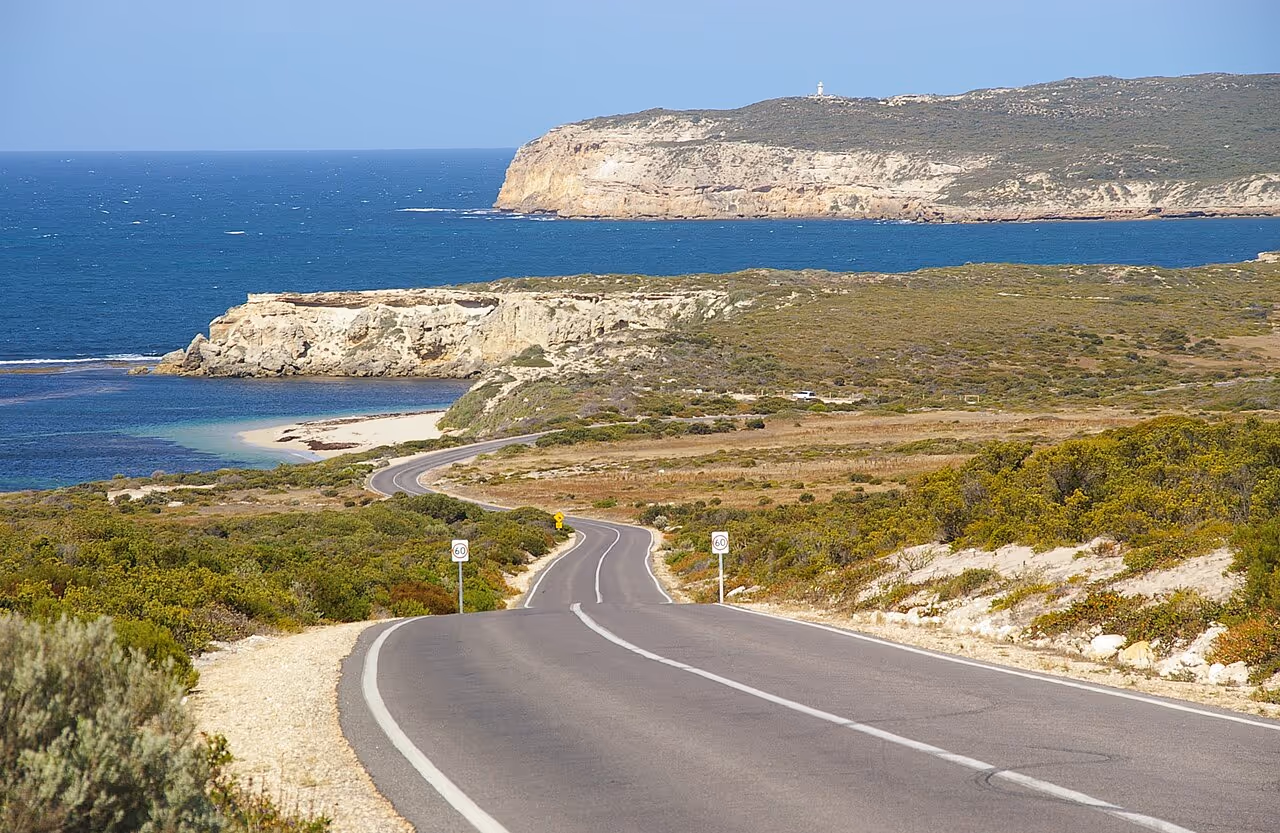 Coastal view of Innes National Park with rugged cliffs, sandy shoreline, and the ocean stretching towards Cape Spencer under a clear sky. Credit: Foraminifera, Wikimedia Commons: https://commons.wikimedia.org/wiki/File:Innes_National_Park.jpg